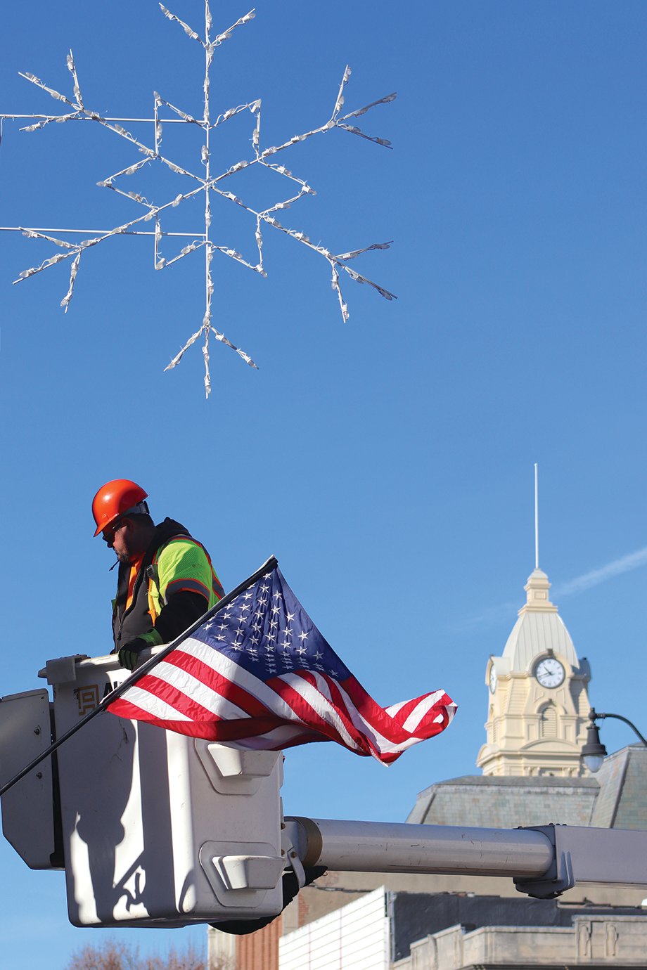 As Thanksgiving and Christmas near, city employees such as Tom Edwards of the Street Department work to ring in the holiday spirit throughout Crawfordsville.